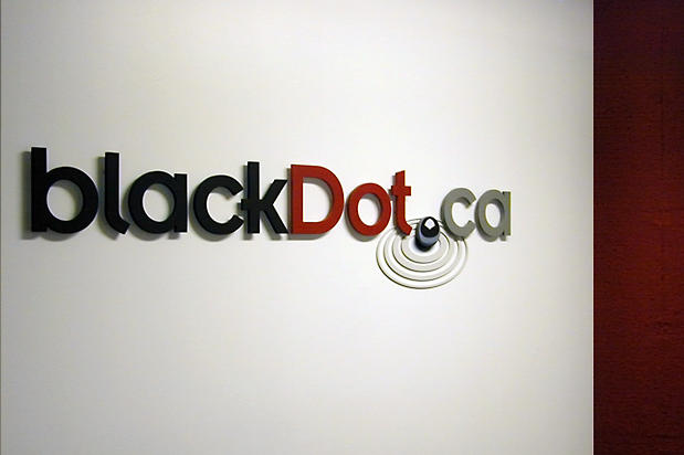 Lobby signage in office reception area for company logo made with custom 3D letters and symbols