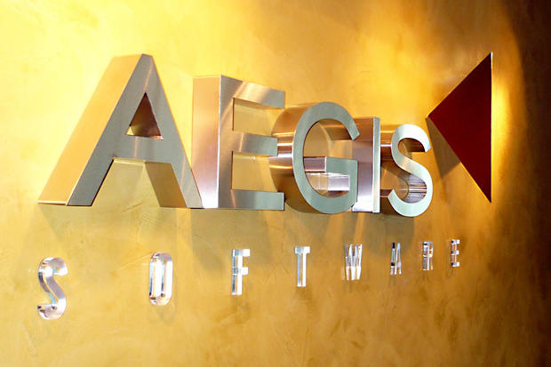 3D corporate office signage made with brushed stainless steel with 2" deep returns as lobby sign in reception area made by Art Signs Company
