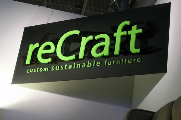 Acrylic exhibit panel sign with painted raised dimensional signage lettering and wood logo for trade show booth made by Art Signs Company