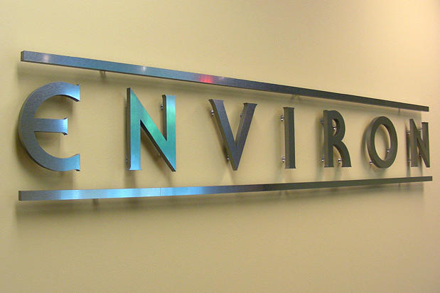 Custom 3D metal business signage lettering for corporate head office lobby reception area wall raised off on pins and installed by Art Signs Company