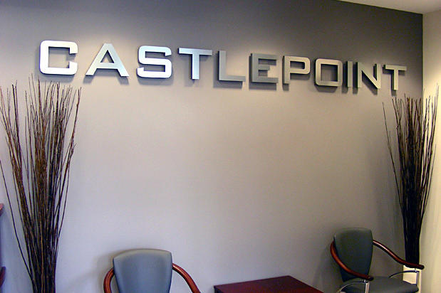 Dimensional brushed metal office sign with acrylic installed on an interior wall for Castlepoint