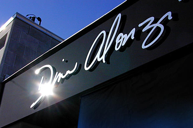 3D sign made of dimensional acrylic letters with brushed stainless steel faces