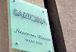 Acrylic Panel Sign installed with stainless steel decorative caps