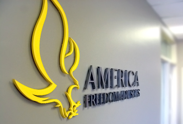 Corporate logo sign with brushed metal finish to match stainless steel look, waiting area wall installation